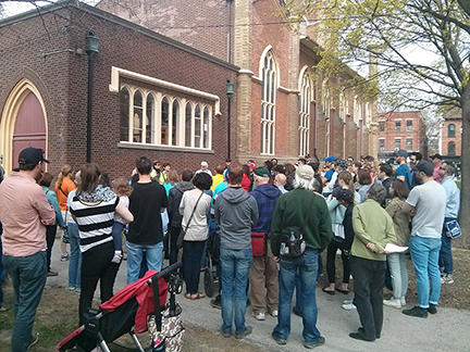 Crowd gathered outside Little Trinity Church for the Three Centuries of Corktown walk during Jane's Walk